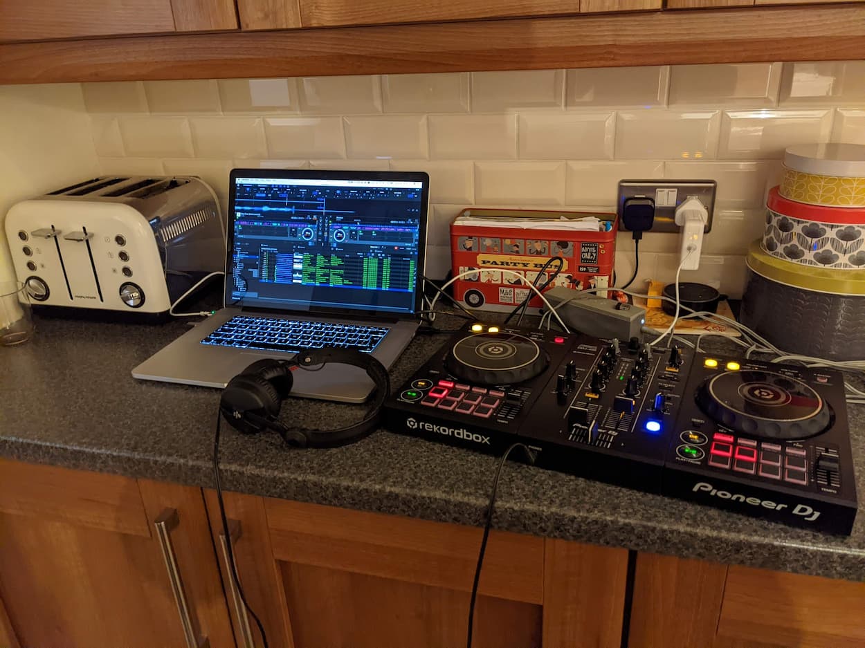Photo of digital dj controller and laptop on a kitchen worktop